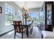 Dining room features a large window for natural light and a built-in china cabinet at 230 S Big Meadow Trl, Franktown, CO 80116