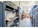 Well-organized garage workspace with cabinets, workbench, tool storage, and bright lighting at 230 S Big Meadow Trl, Franktown, CO 80116