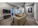 Relaxing living room with comfortable seating and entertainment center at 230 S Big Meadow Trl, Franktown, CO 80116
