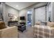 Inviting living room with comfortable seating and view into bedroom at 230 S Big Meadow Trl, Franktown, CO 80116