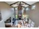 The living room features a soaring stone fireplace and a comfortable seating area at 230 S Big Meadow Trl, Franktown, CO 80116