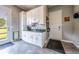 Mud room provides convenience with storage cabinets, a sink, and access to the outdoors at 230 S Big Meadow Trl, Franktown, CO 80116