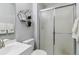 Bathroom featuring a glass-enclosed shower and modern sink at 5425 W 115Th Pl, Westminster, CO 80020