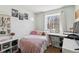 Cozy bedroom with a twin bed, plush details, and ample natural light at 5425 W 115Th Pl, Westminster, CO 80020