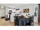 Dining area with a round table and a view of the adjacent kitchen at 5425 W 115Th Pl, Westminster, CO 80020
