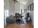 Bright living room with vaulted ceilings, a fireplace, and hardwood floors at 5425 W 115Th Pl, Westminster, CO 80020