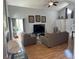 Cozy living room with vaulted ceilings, fireplace, and new flooring at 5425 W 115Th Pl, Westminster, CO 80020