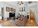 Open-concept living room with vaulted ceiling, light-colored walls, and hardwood flooring at 5425 W 115Th Pl, Westminster, CO 80020