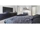Main bedroom featuring a large bed and dark furniture at 5425 W 115Th Pl, Westminster, CO 80020
