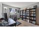 Spacious office with ample shelving for books, a modern desk, and a calming window at 5425 W 115Th Pl, Westminster, CO 80020