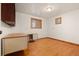 Cozy bedroom with hardwood floors, desk area and natural light at 723 Brussels Dr, Parker, CO 80138