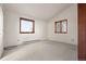 Cozy bedroom featuring neutral carpet, natural lighting from two windows, and a closet at 723 Brussels Dr, Parker, CO 80138