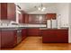 Spacious kitchen with granite countertops, stainless steel appliances, and ample cabinet storage at 723 Brussels Dr, Parker, CO 80138