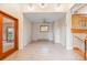 Inviting living space with tile flooring, natural light, and open access to the staircase at 723 Brussels Dr, Parker, CO 80138