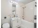Bright bathroom with a modern vanity, a vessel sink, and a shower-over-tub at 300 W 11Th Ave # 4F, Denver, CO 80204