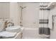 Bright bathroom with modern vanity, vessel sink, shower-over-tub, and tiled walls at 300 W 11Th Ave # 4F, Denver, CO 80204