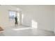 Well-lit bedroom with bright walls and flooring, plus a nice view from the window at 300 W 11Th Ave # 4F, Denver, CO 80204