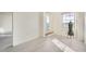 Bright bedroom featuring a sliding glass door, a window, and light gray plank flooring at 300 W 11Th Ave # 4F, Denver, CO 80204