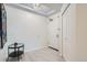 Bright entryway with a stylish light fixture, tiled floor, and closet at 300 W 11Th Ave # 4F, Denver, CO 80204
