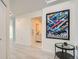 Hallway featuring modern tile flooring, art, and a view into the bathroom at 300 W 11Th Ave # 4F, Denver, CO 80204