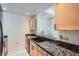 Kitchen features granite countertops, light wood cabinets, and modern stainless steel appliances for a functional, modern space at 300 W 11Th Ave # 4F, Denver, CO 80204