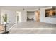 Open living room featuring modern floors and a kitchen view, perfect for entertaining at 300 W 11Th Ave # 4F, Denver, CO 80204