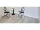 Sitting area featuring modern tile flooring and two accent chairs at 300 W 11Th Ave # 4F, Denver, CO 80204