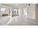 Spacious room with large windows, gray flooring, and access to an outdoor balcony at 300 W 11Th Ave # 4F, Denver, CO 80204