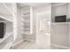 Spacious walk-in closet with a vanity, a window, and built-in shelving at 300 W 11Th Ave # 4F, Denver, CO 80204