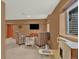 Finished basement featuring comfortable seating area, a play area, and modern television at 3973 S Joplin Way, Aurora, CO 80013