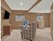 Finished basement with comfortable seating area, neutral carpeting, and recreational space at 3973 S Joplin Way, Aurora, CO 80013