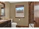 This bathroom features a large window for natural lighting, a walk-in shower, and a sink at 3973 S Joplin Way, Aurora, CO 80013