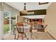 Charming dining area featuring a rustic light fixture, dining table with chairs and a backyard view at 3973 S Joplin Way, Aurora, CO 80013