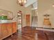 Entryway featuring hardwood floors, a decorative buffet cabinet, and seamless access to other rooms at 3973 S Joplin Way, Aurora, CO 80013