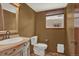 This half bathroom is equipped with a nice window for natural lighting at 3973 S Joplin Way, Aurora, CO 80013