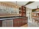 Kitchen featuring custom cabinetry, granite countertops, stainless steel appliances, and a window at 3973 S Joplin Way, Aurora, CO 80013