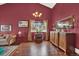 Cozy living room boasting a picture window, hardwood floors, and elegant furnishings at 3973 S Joplin Way, Aurora, CO 80013