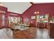 The formal living room features hardwood floors, a large window, and traditional decor at 3973 S Joplin Way, Aurora, CO 80013