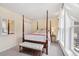 Charming bedroom featuring a classic four-poster bed and a comfortable bench at 45 Bridge St, Breckenridge, CO 80424
