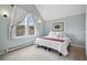 Well-lit bedroom featuring neutral colors, a window view, and carpeted floors at 45 Bridge St, Breckenridge, CO 80424