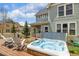 Relax in this home's private hot tub, located just outside the back door, with outdoor furniture for lounging at 45 Bridge St, Breckenridge, CO 80424