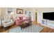 Cozy living room featuring hardwood floors, natural light, and a comfortable seating arrangement at 45 Bridge St, Breckenridge, CO 80424