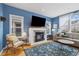 Stylish living room featuring a cozy fireplace, a large television, and comfortable seating at 45 Bridge St, Breckenridge, CO 80424