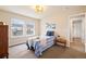 Comfortable bedroom with cozy carpet, natural light, and neutral colors. Ready for a relaxing night at 14284 W 88Th Dr # B, Arvada, CO 80005