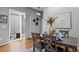 Cozy dining room featuring modern decor, hardwood floors, and sliding door to patio at 14284 W 88Th Dr # B, Arvada, CO 80005