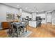 Modern kitchen with white cabinets, stainless steel appliances, and an adjacent dining area at 14284 W 88Th Dr # B, Arvada, CO 80005