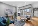 Inviting living room with a cozy fireplace, large windows, and a comfortable seating area at 14284 W 88Th Dr # B, Arvada, CO 80005