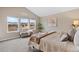 Bright main bedroom with vaulted ceilings, large windows, and a serene view at 14284 W 88Th Dr # B, Arvada, CO 80005