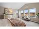 Inviting main bedroom with scenic views, bench seating, and tranquil decor at 14284 W 88Th Dr # B, Arvada, CO 80005
