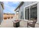 Covered patio offers outdoor seating, a fire pit, and views of the surrounding neighborhood at 14284 W 88Th Dr # B, Arvada, CO 80005